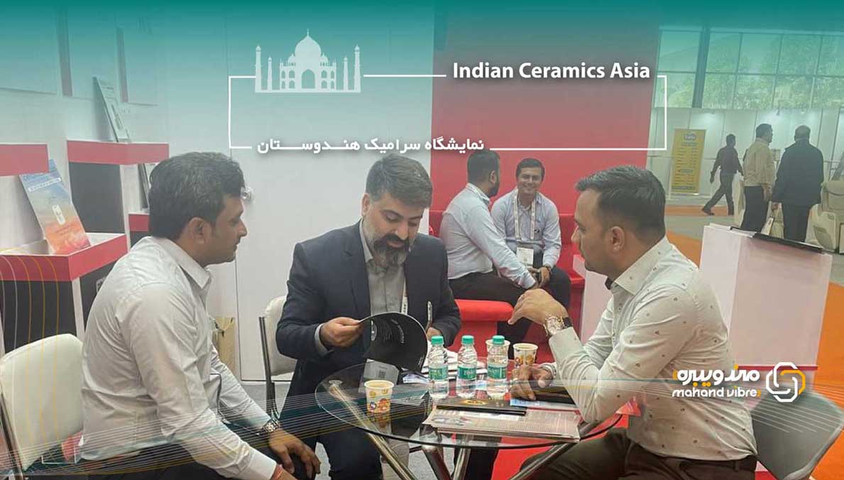 A man negotiating at the Indian tile and ceramic exhibition for the purchase and export of vibrating sieves